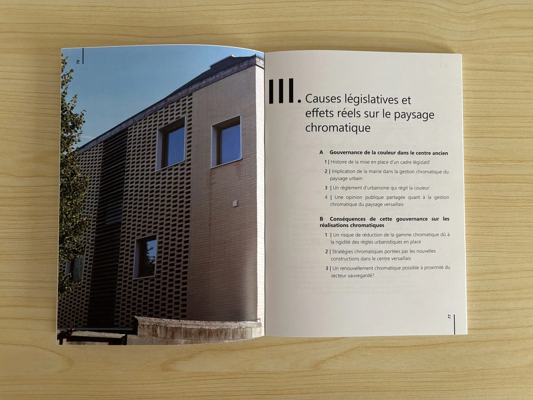 Spread: a contemporary dark-brick building and the chapter on the legislative causes of the chromatic landscape