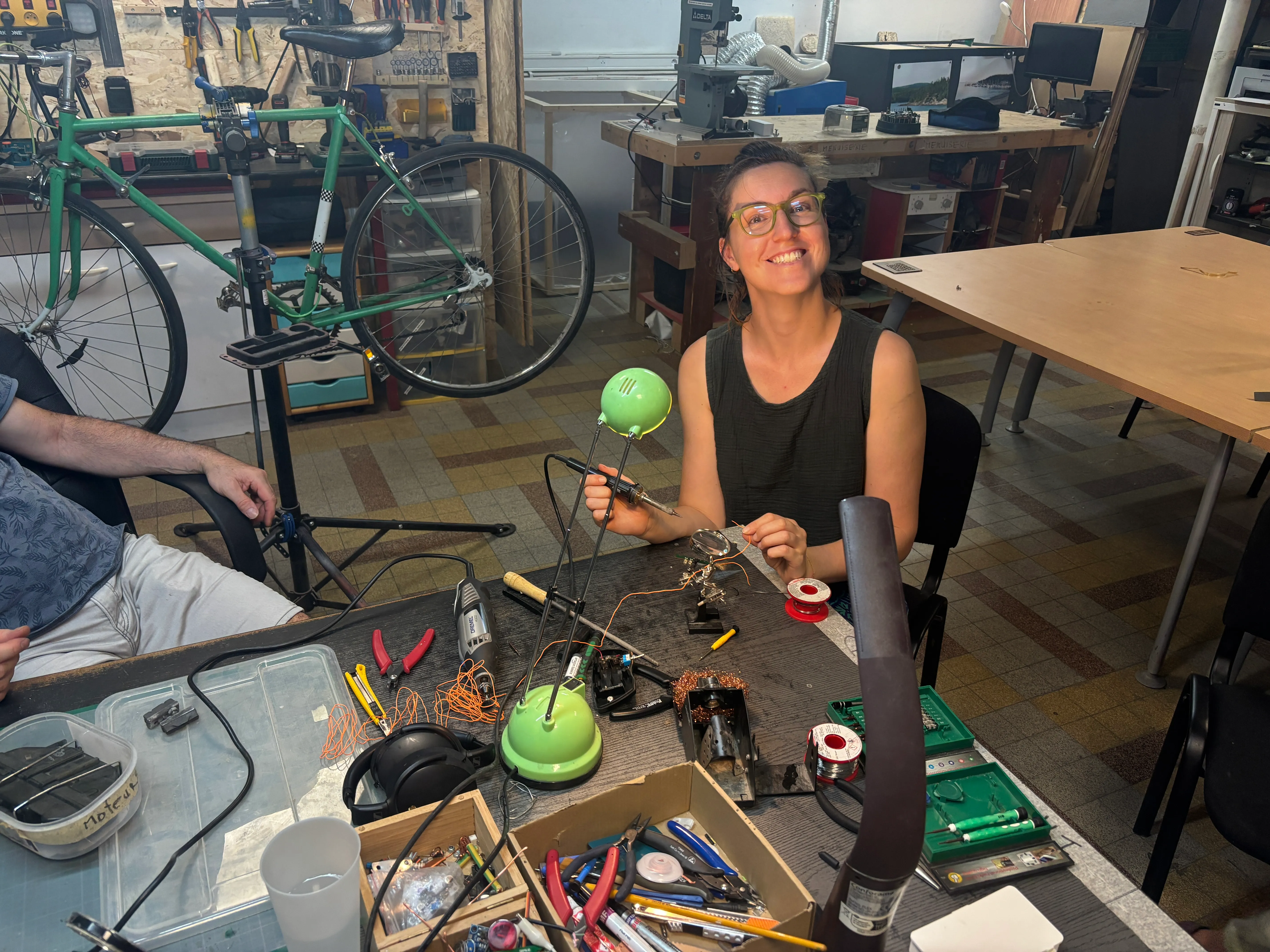 At a FabLab bench, soldering electronics